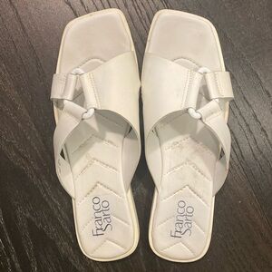 Modern, comfortable slip on sandal with quilted footbed, white buckle detail